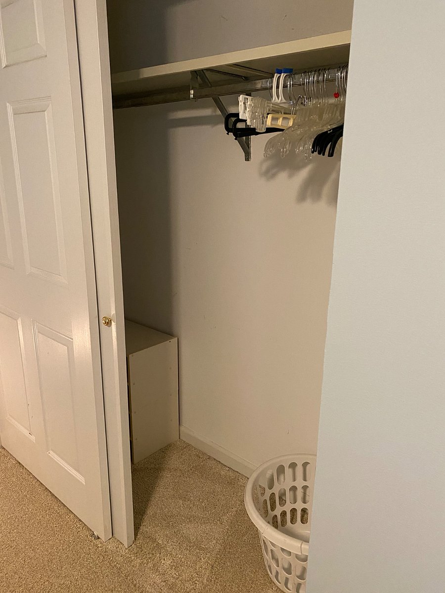 Large closet equipped with shelving, hangers and laundry basket