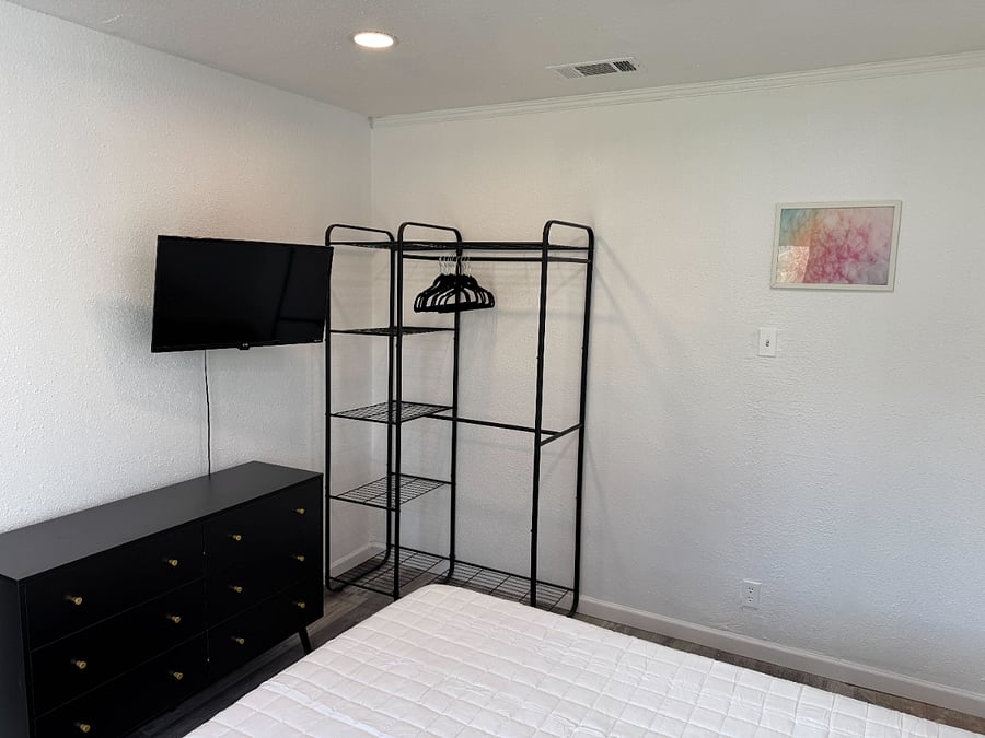 Bedroom 3 - Full memory foam bed, sheets, 4k smart tv. No closet, but we did provide a standing clothing organizer along with additional hanger, dresser and 4K smart tv.