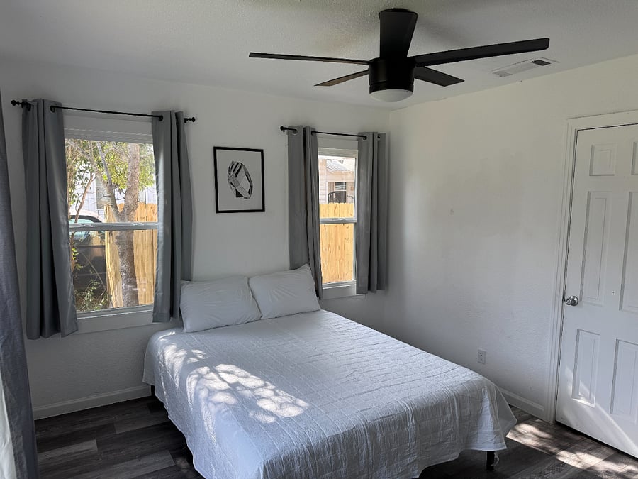 Bedroom 1 - Rooms come with bedding, blackout curtains, hangers, dresser, and 4k smart tv