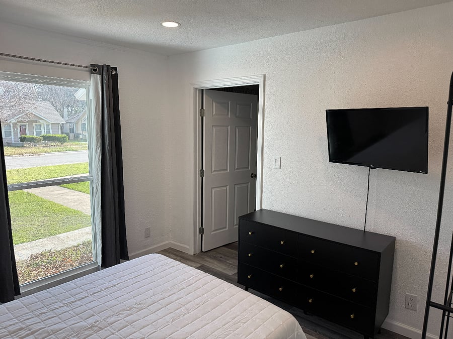 Bedroom 3 - Window equipped with room darkening shades / blackout curtains. 