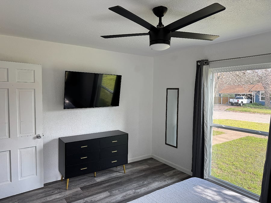 Bedroom 1 - Rooms come with bedding, blackout curtains, hangers, dresser, and 4k smart tv