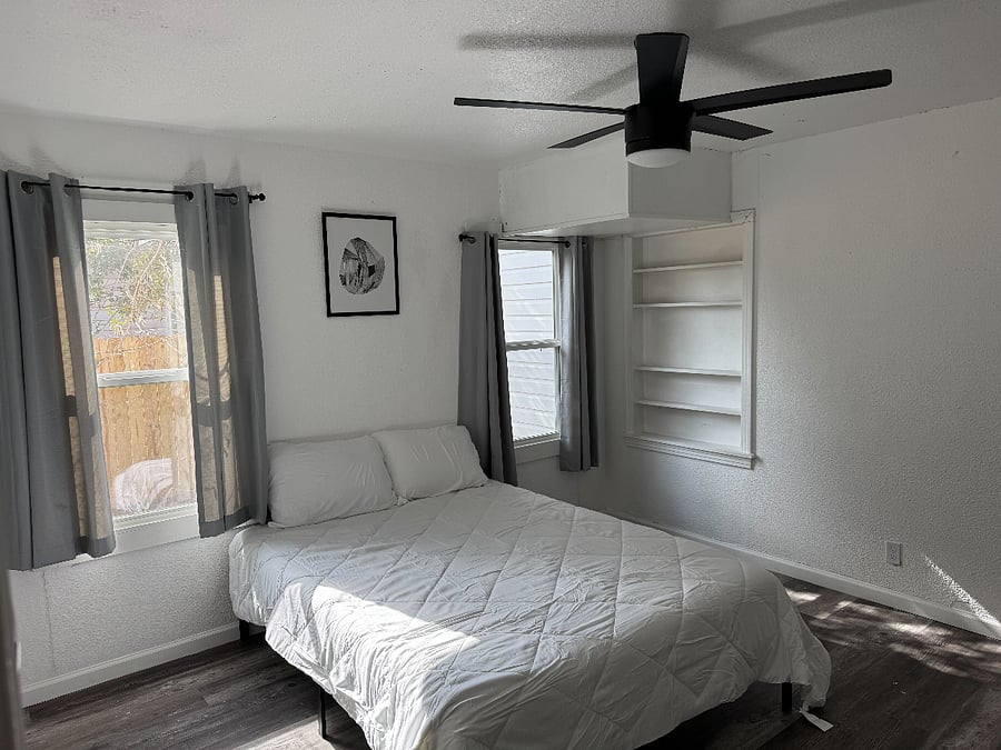 Bedroom 2 - Rooms come with bedding, blackout curtains, hangers, dresser, and 4k smart tv