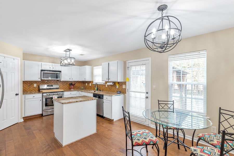 Sunny, full kitchen with breakfast nook