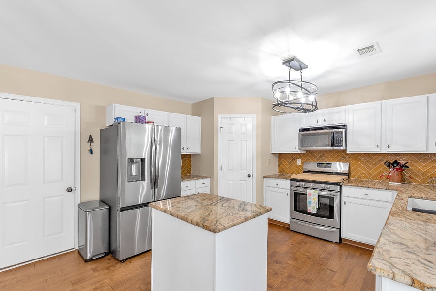 Kitchen with all appliances and easy garage and back yard access.