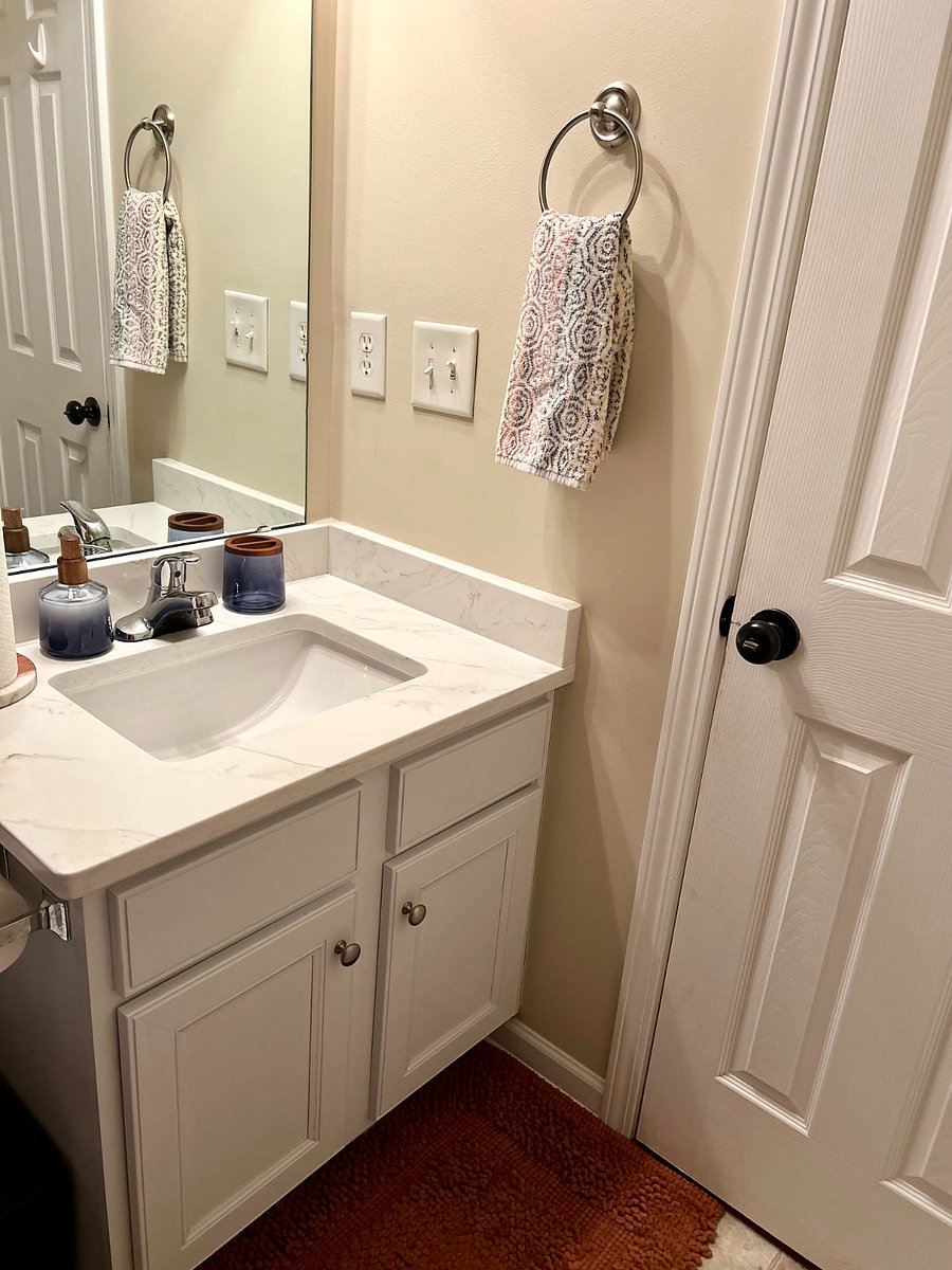 Granite countertop single vanity with cleaning supplies provided