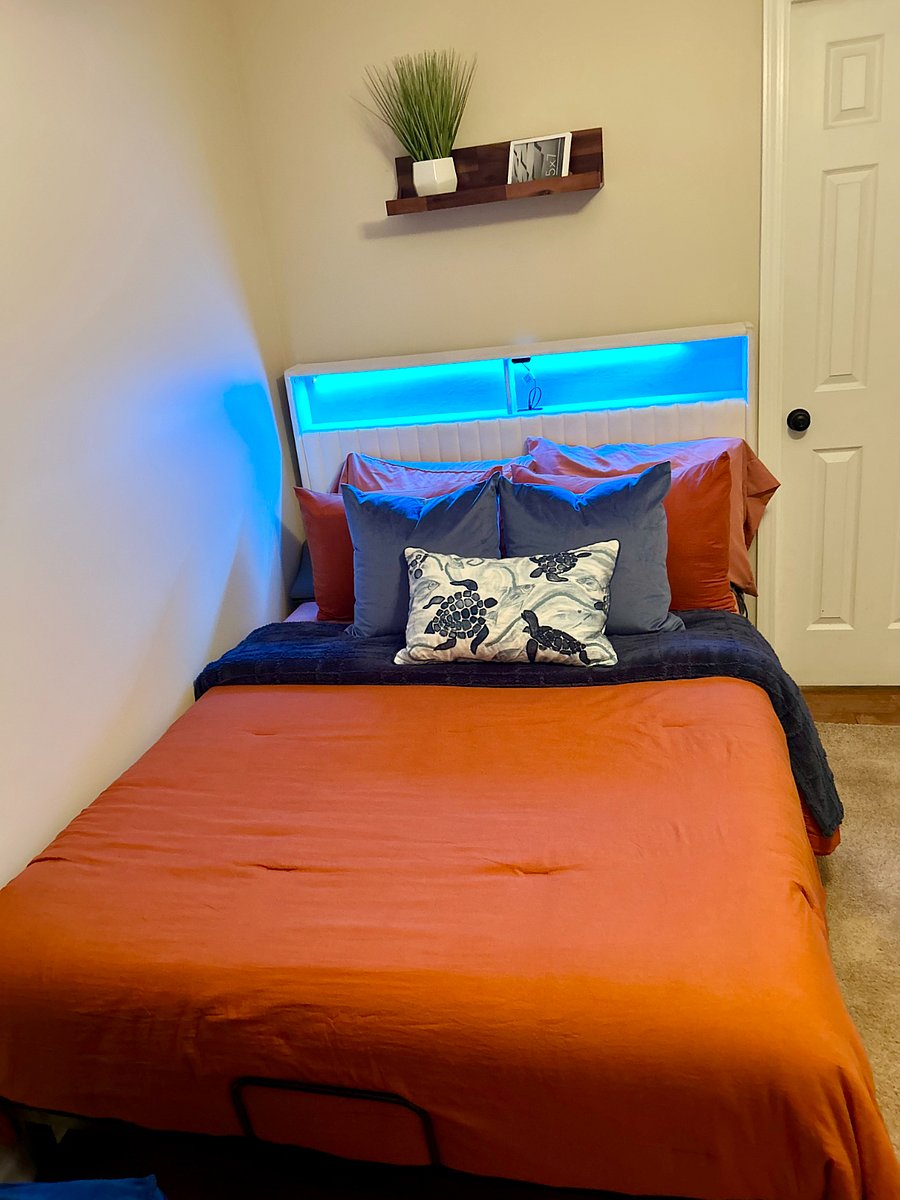 Bedframe is adjustable to raise head of bed. Color changing LED lights and power ports in headboard. Sumptuous bed linens provided.