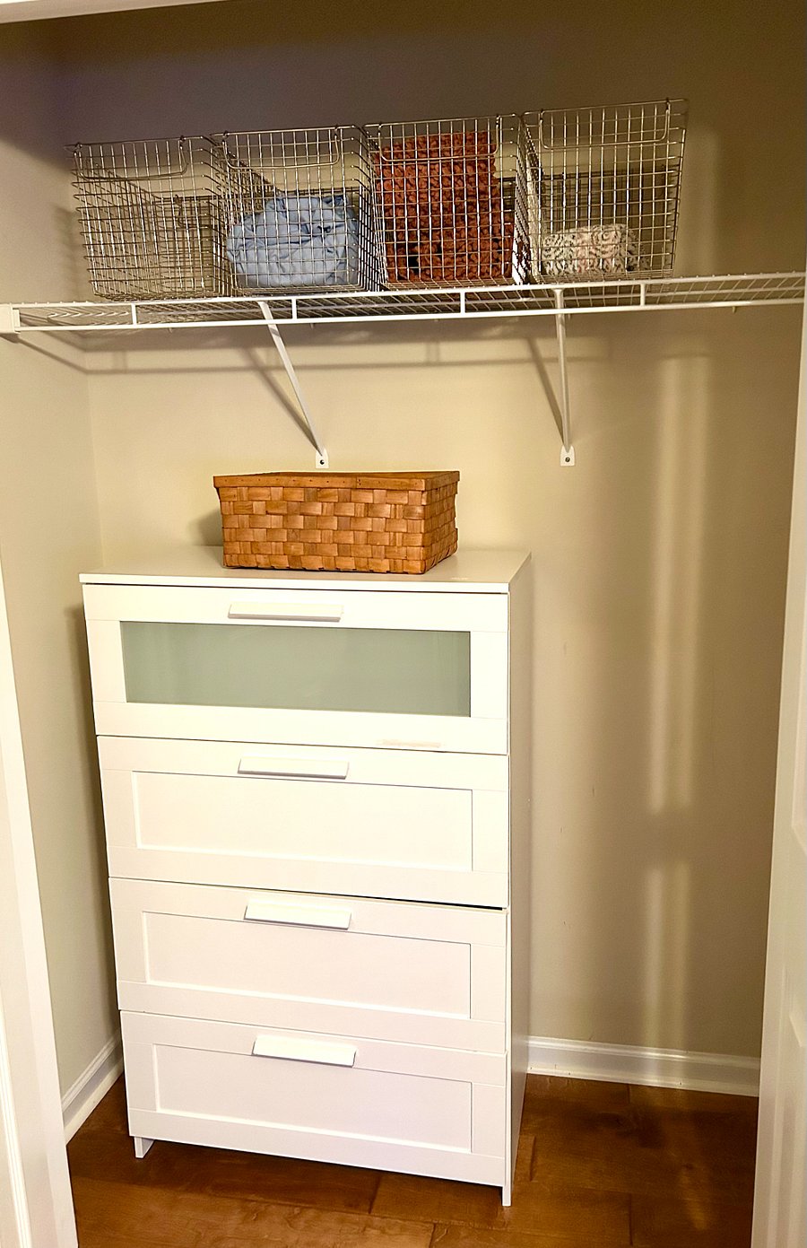 Dresser and decorative storage bins in second, spacious closet