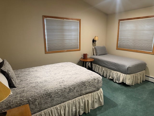 Third bedroom with queen and single beds with ensuite full bathroom.