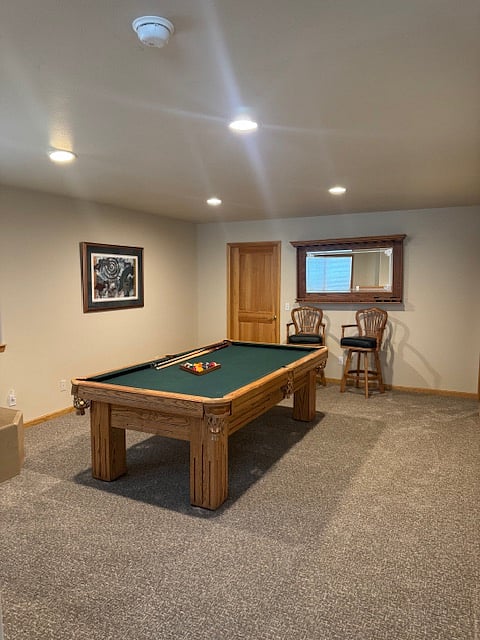 Rec room with pool table and gas fireplace