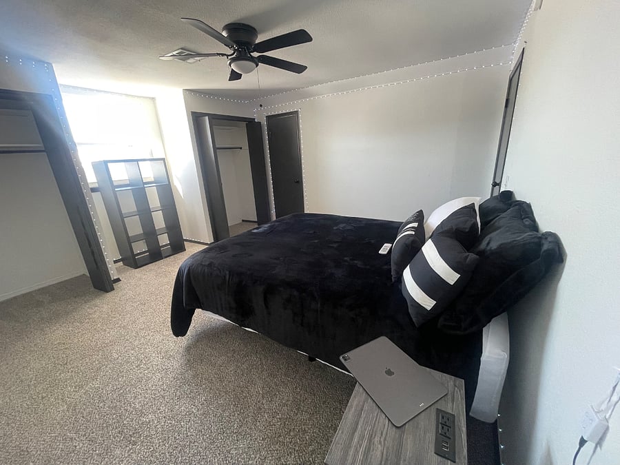 Master bedroom with side table/electronic plug in feature.