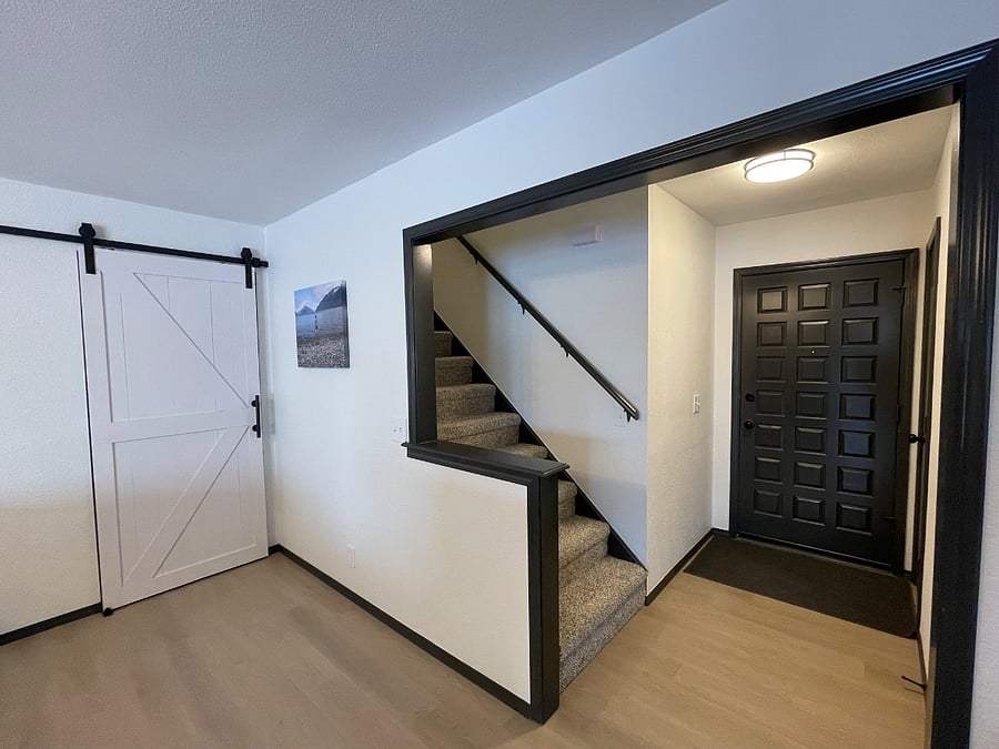 Shared enterance with stairs leading to private rental area (barndoor leads to private rooms/bathrooms downstairs)