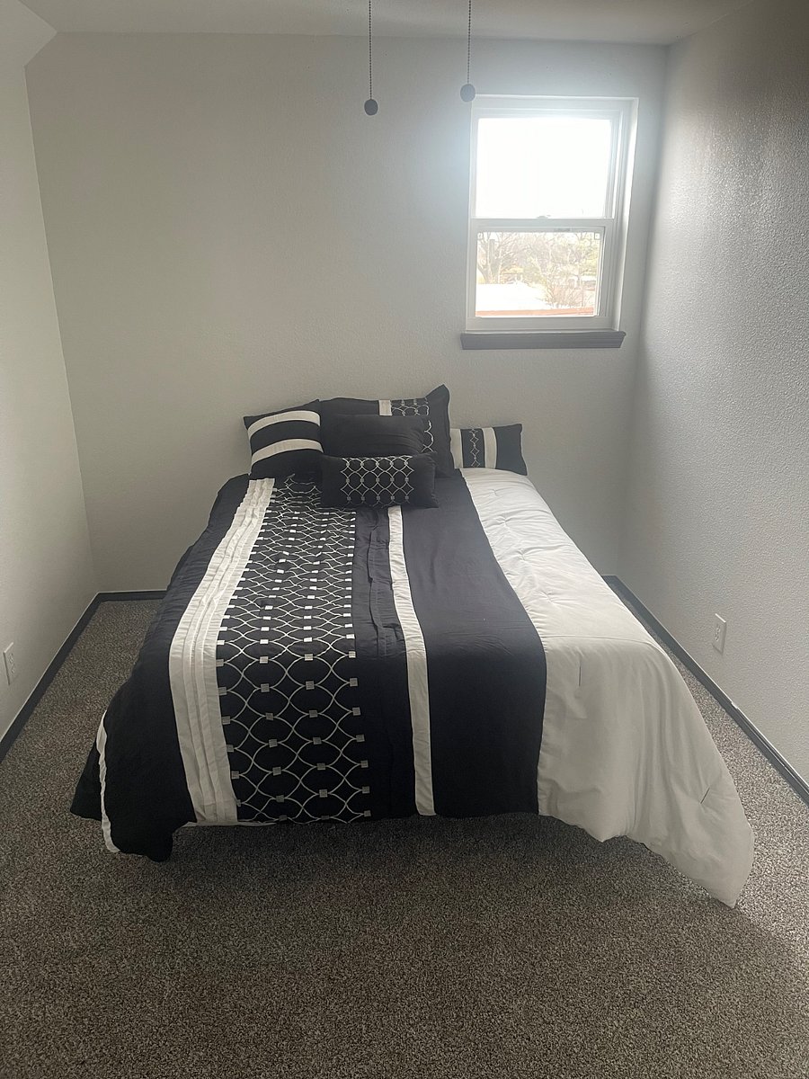second small room upstairs with full size bed/closet/built in storage area