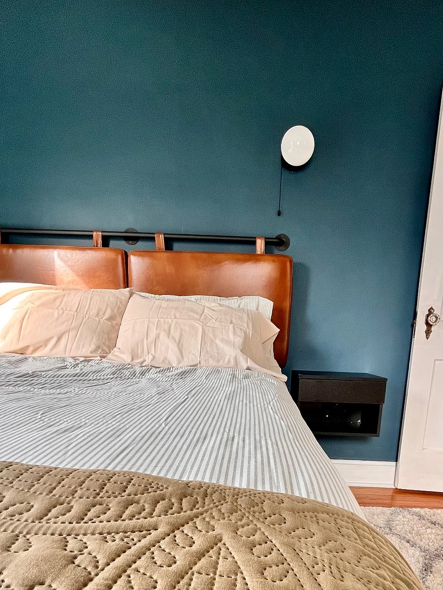 1st Bedroom to the right of of the Bathroom. Queen Size Memory foam Mattress, Vegan leather headboard, vintage Wardrobe. Closet and plenty of under bed storage.