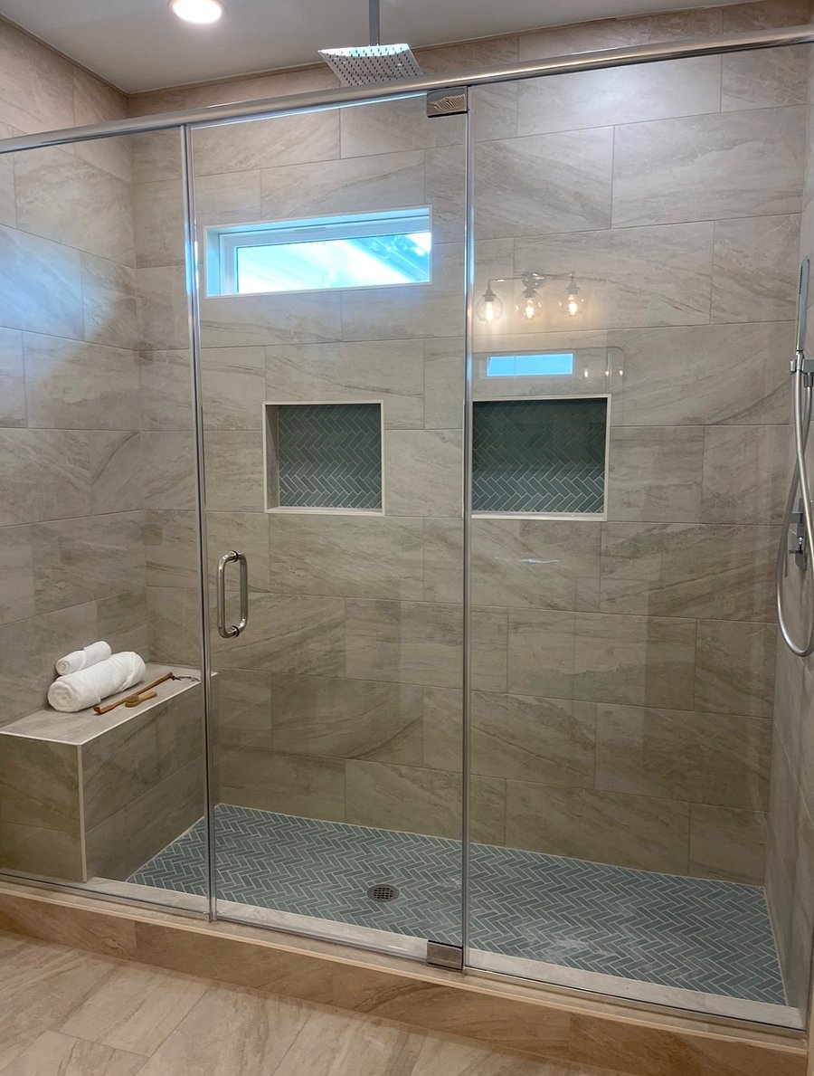 Uptown en-suite attached bath with a beautiful waterfall shower.