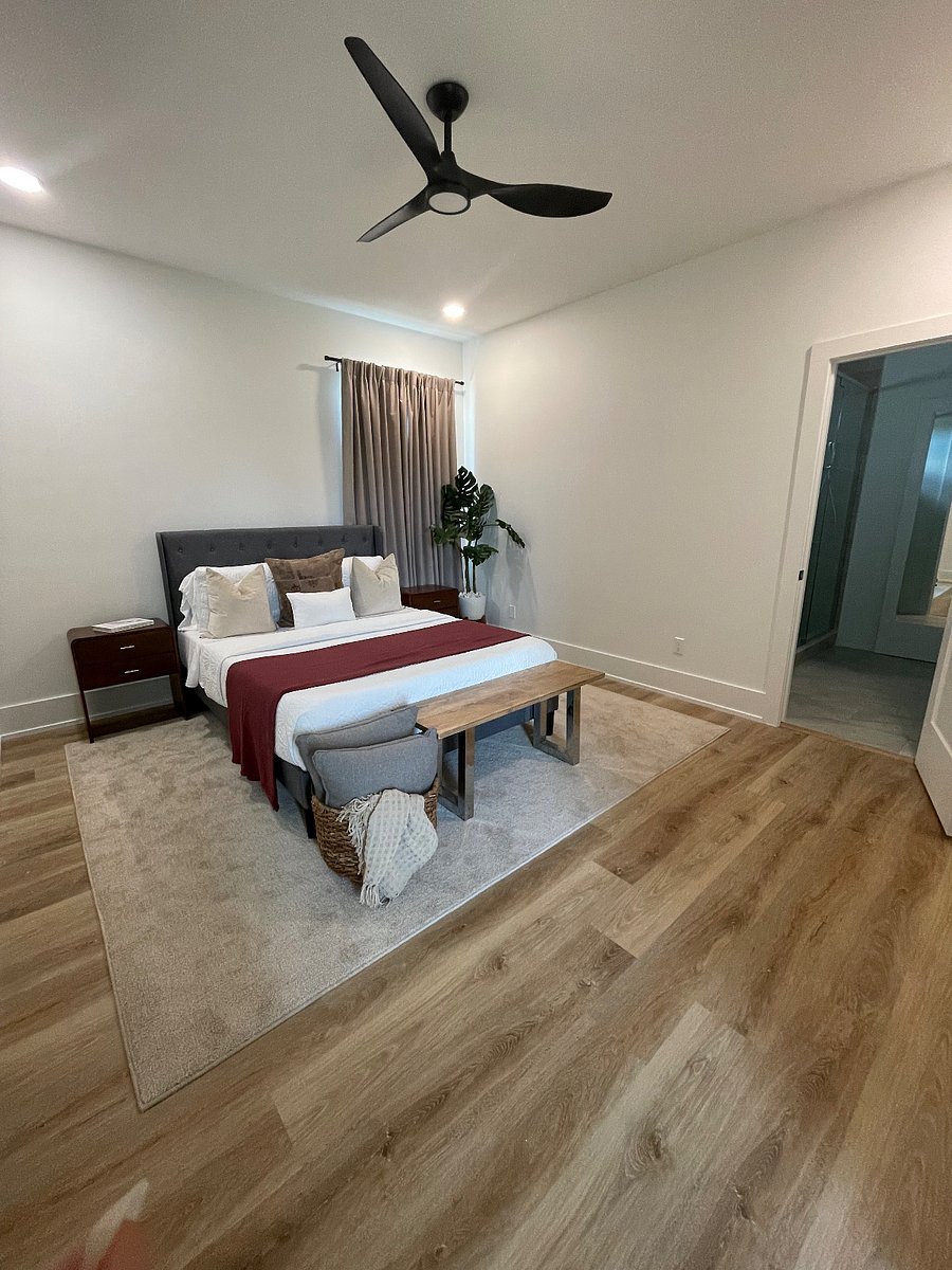 Uptown en-suite features a waterfall shower with seating, built-in closet, ceiling fan, and great storage space.