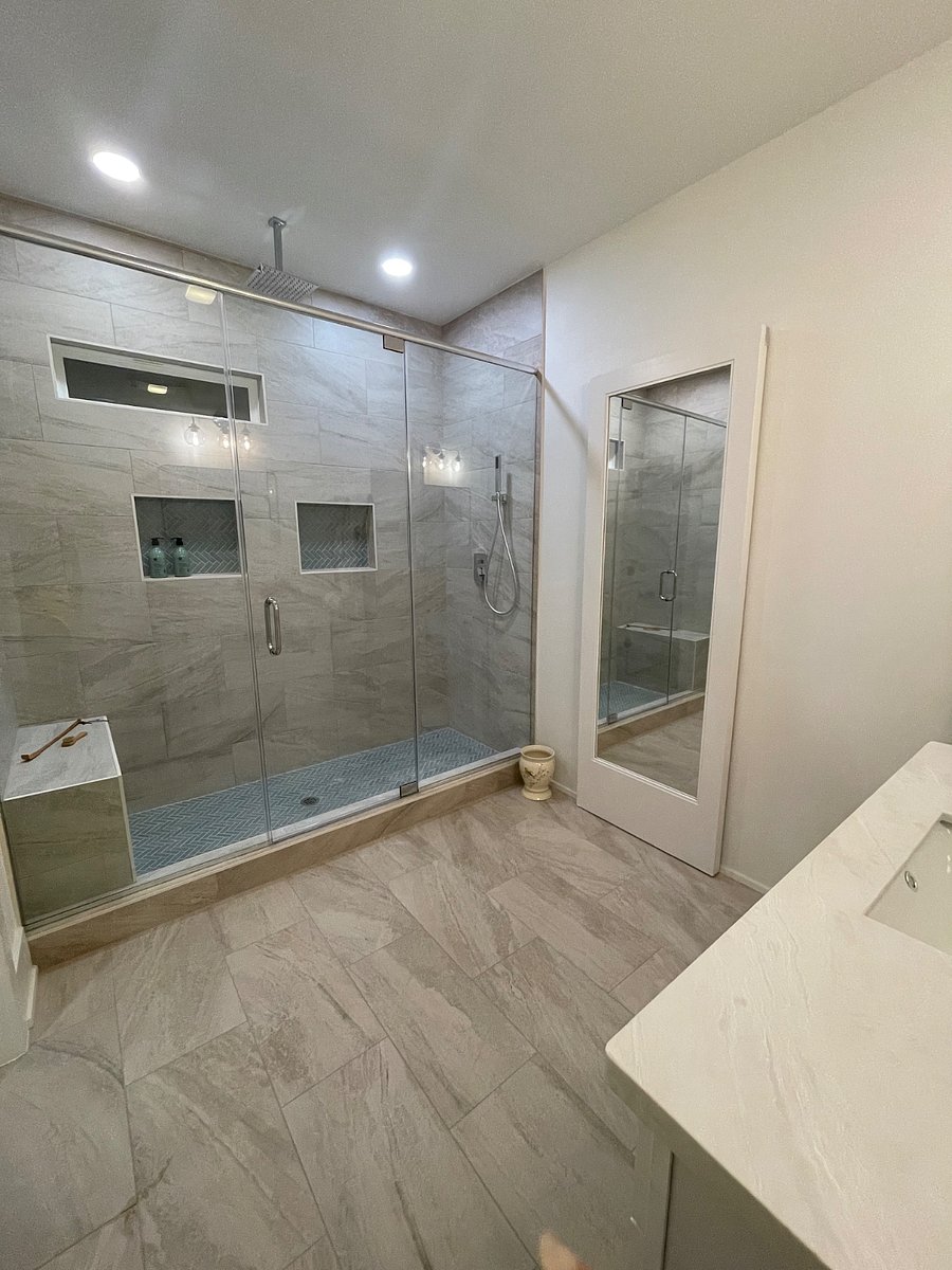 Oversized attached waterfall shower in our Uptown suite.