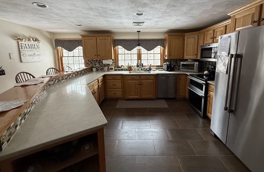 view from dining area into large kitchenview 