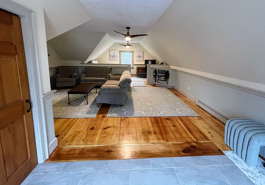 view from the sliding entrance into the living room that has the full bed and office area
