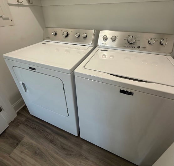 Washer and Dryer. The washroom is adjacent to the kitchen (next to the dishwasher).