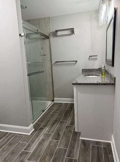 Master Bedroom en suite: sink and shower area. Toilet, to the left, not pictured.
