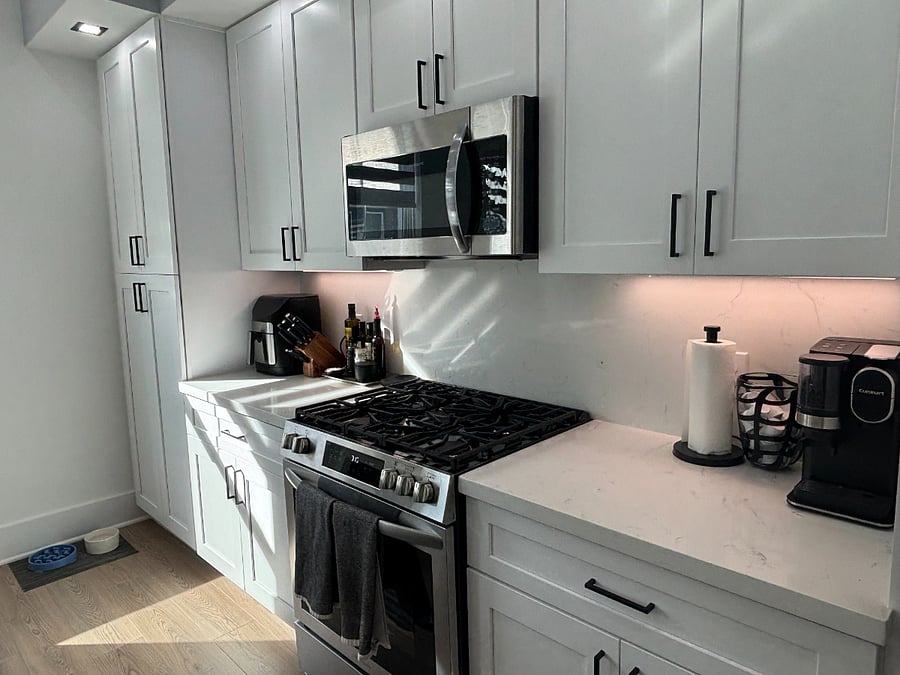Fully equipped kitchen with new fridge.