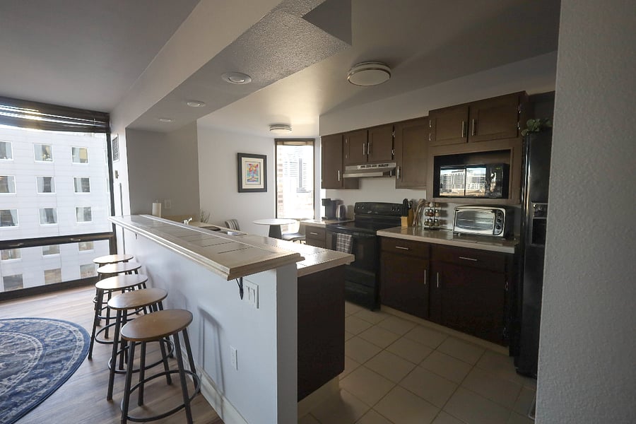 Full kitchen opens to the dining area with space at the bar for guests to watch you cook!