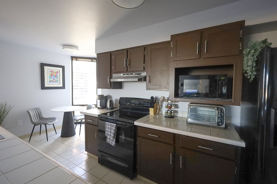 A nice eating nook sits in the back corner of the kitchen, overlooking the community garden The kitchen is complete with a microwave, Keurig & press coffee pots, a toaster oven and everything you need to settle in.