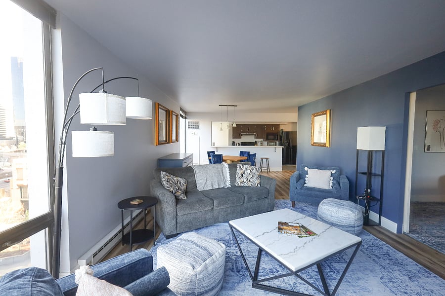 Living room has seating for friends to spread out and dining room seating for a delicious meal.
