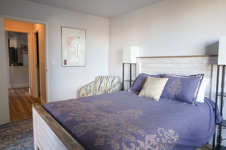This comfortable queen bedroom connects to the bathroom and has access to the main living room.