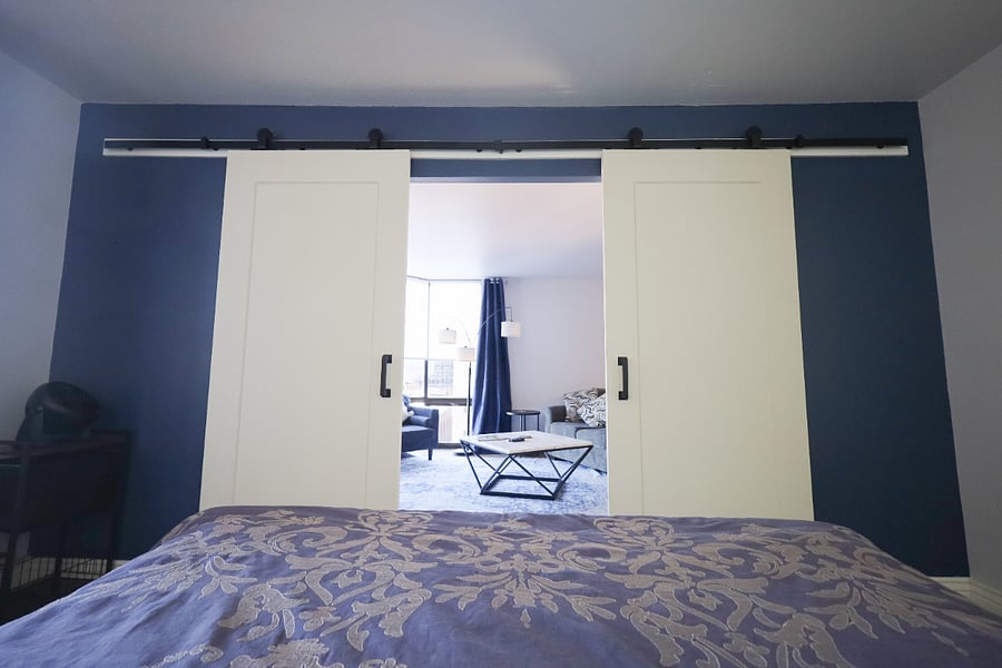 While the bedroom has room darkening shades, you can always leave the barn doors open to catch a glimpse of the skyline.