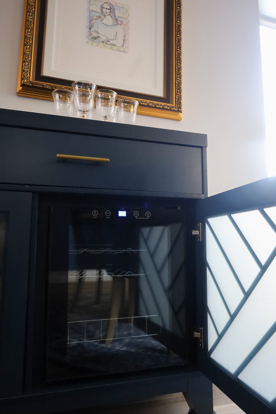A wine fridge is in the dining area and second bedroom cupboard.