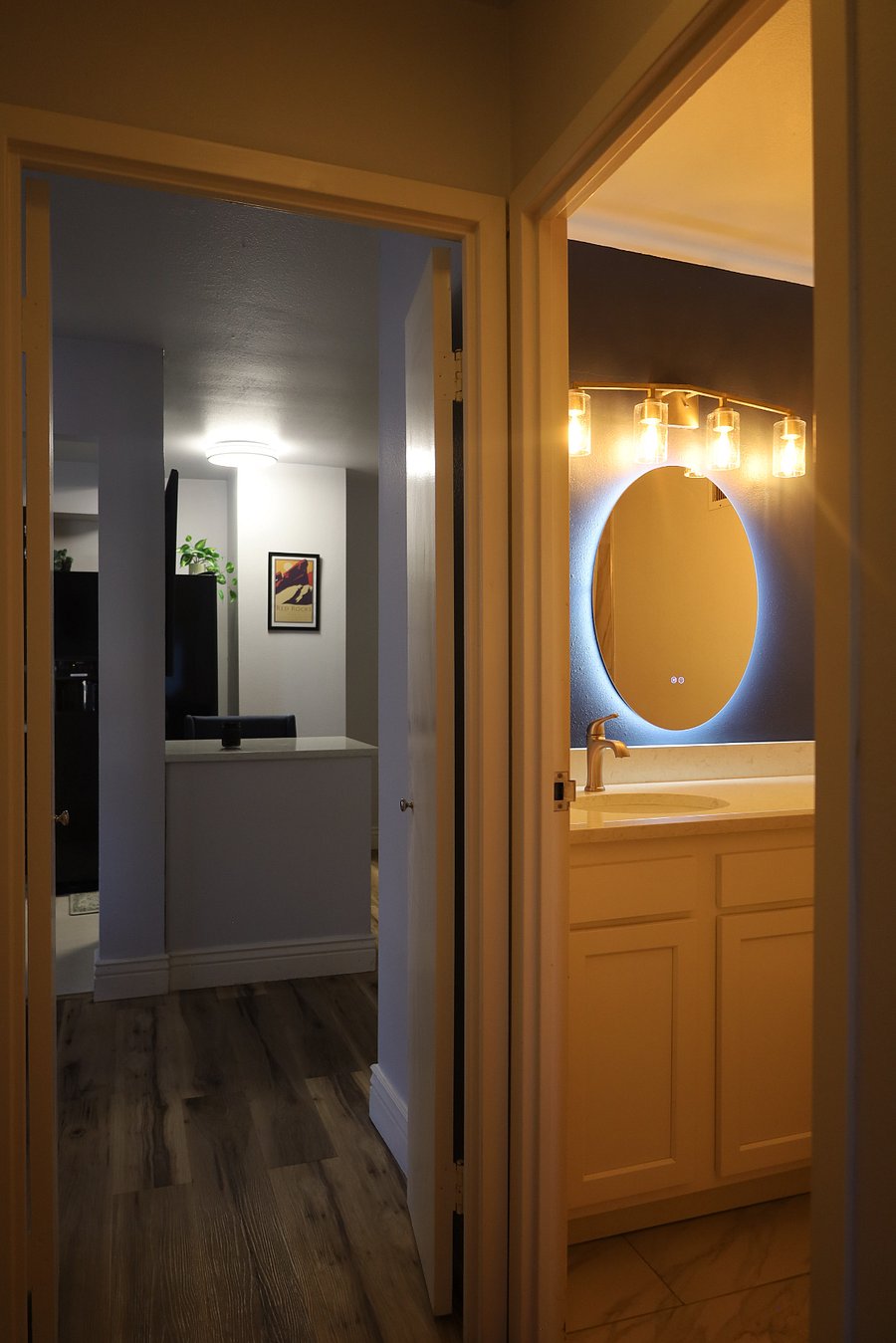 Hallway connecting the bedroom to the kitchen area.