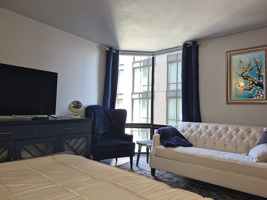 2-Bedroom Option: Second en suite bedroom with a sitting area sits off the front foyer. 