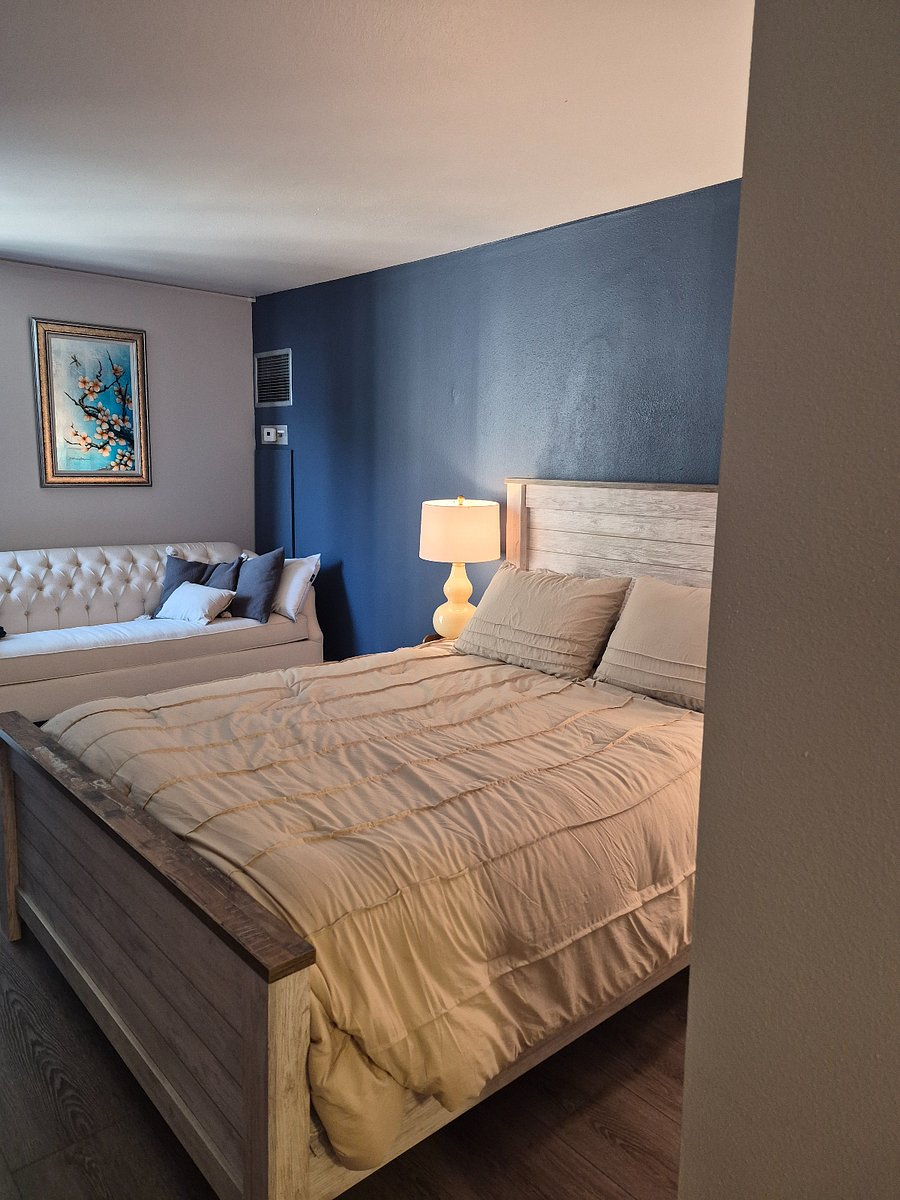 Second en suite bedroom with a sitting area sits off the front foyer. 