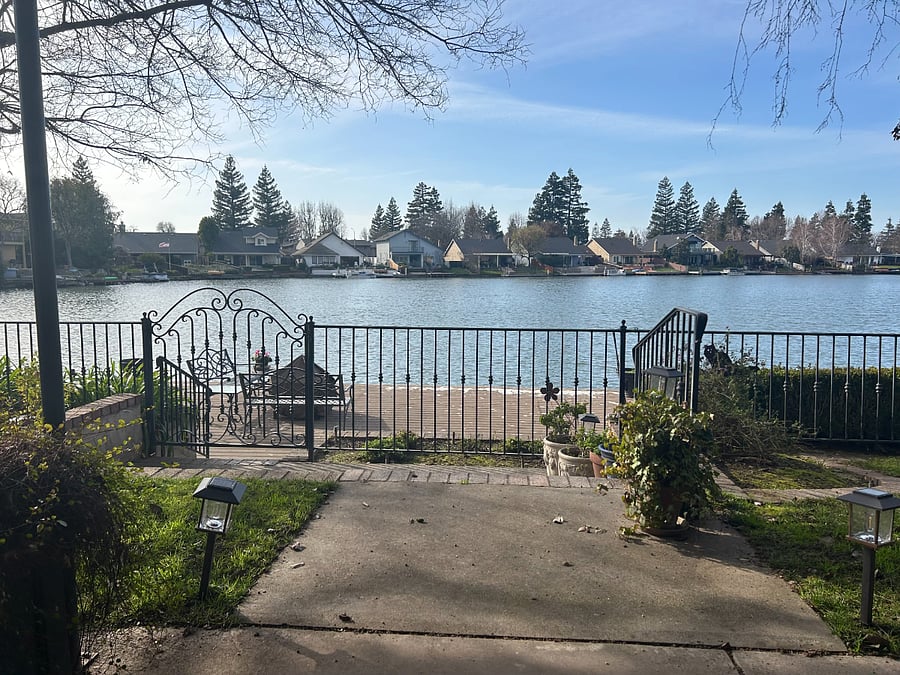 Covered patio and access to dock on the lake