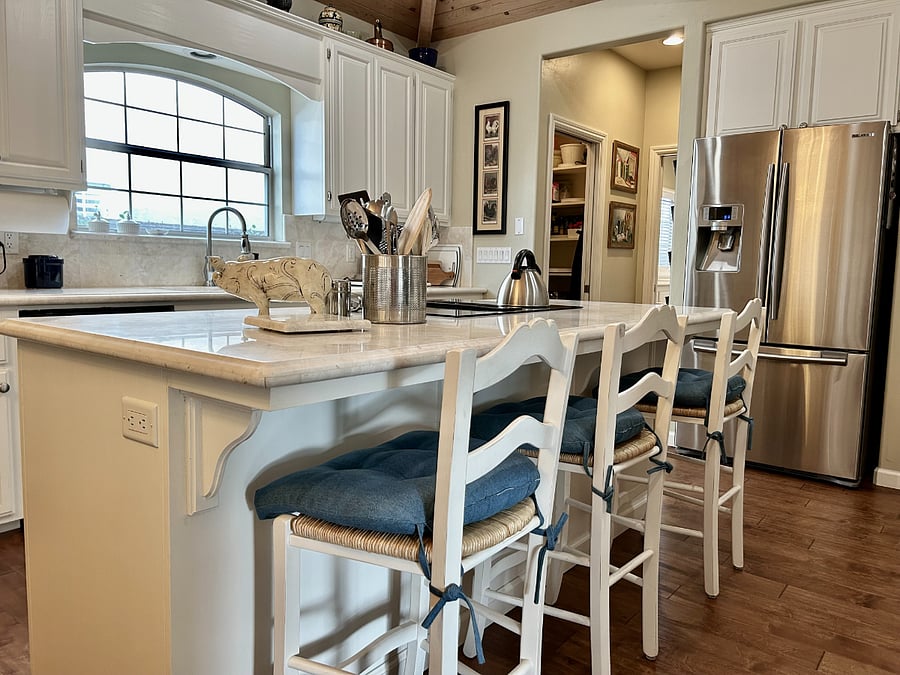 Marble topped island bar seating