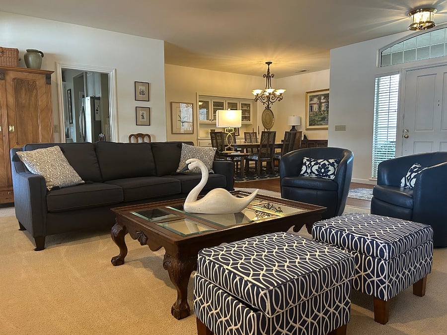Family room with tv, fireplace and lake views