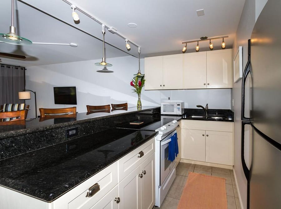 Kitchen comes fully furnished.  Not shown but in the kitchen coffee maker, coffee grinder, blender, knife block, pots, pans, utensils, serveware, dishes, baking pans, etc.  If there is something you need, I'll be happy to share from my kitchen upstairs.