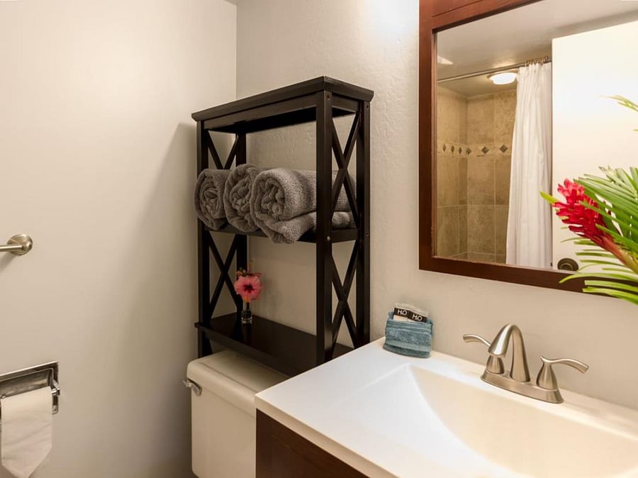 Master bathroom attached to bedroom features a shower with a Japanese style sit tub.  Great for cleaning up kiddos coming in from the beach.