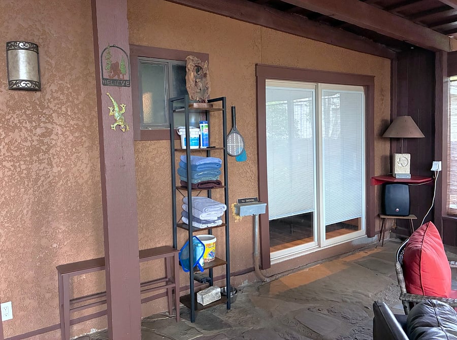 Sliding Glass Door from Master Bedroom to Enclosed Flagstone Patio featuring Towel Rack