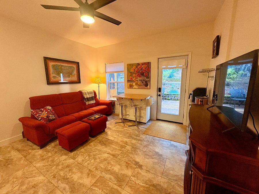 Livingroom area in same room as kitchenette. The kitchen cart is on wheels and can be rolled to kitchen area for extra storage and counter space.