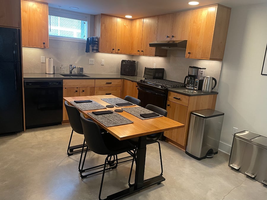 Kitchen with adjustable height table.