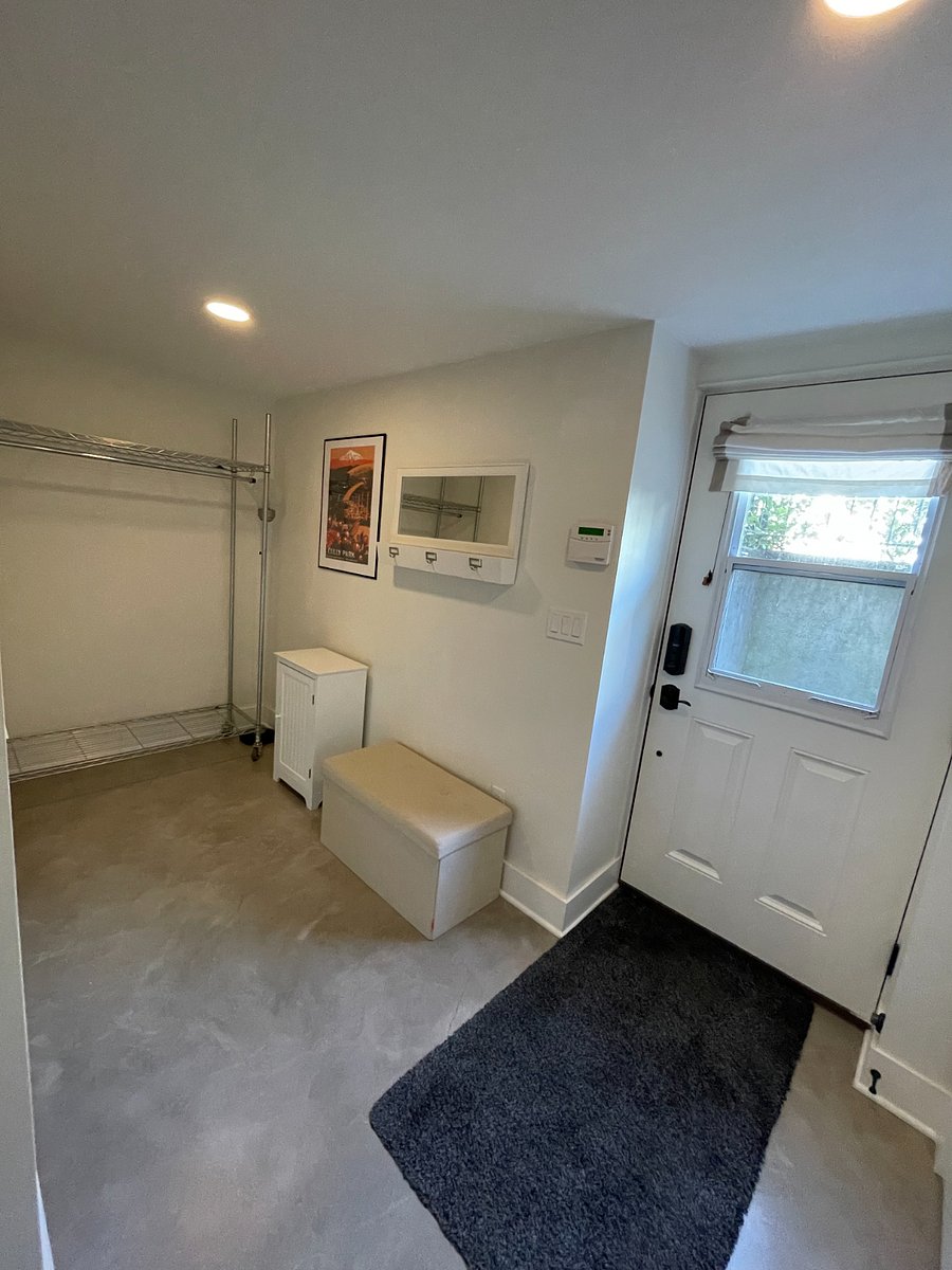 Mudroom/entryway with alarm panel.