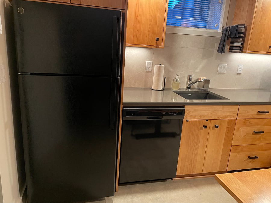 Full-size fridge and dishwasher.