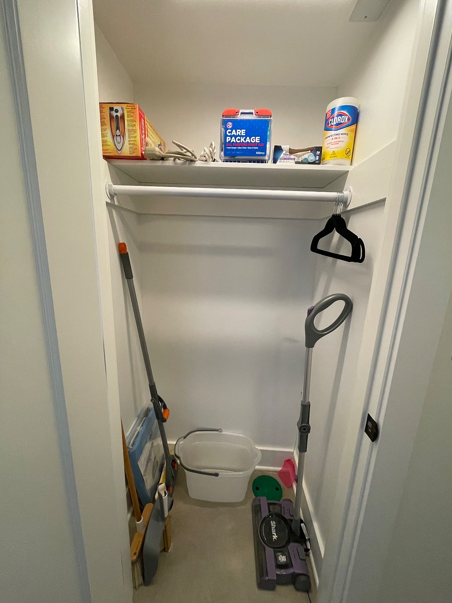 Entry closet with cleaning tools and supplies