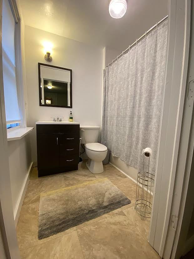 full bathroom attached to primary bedroom