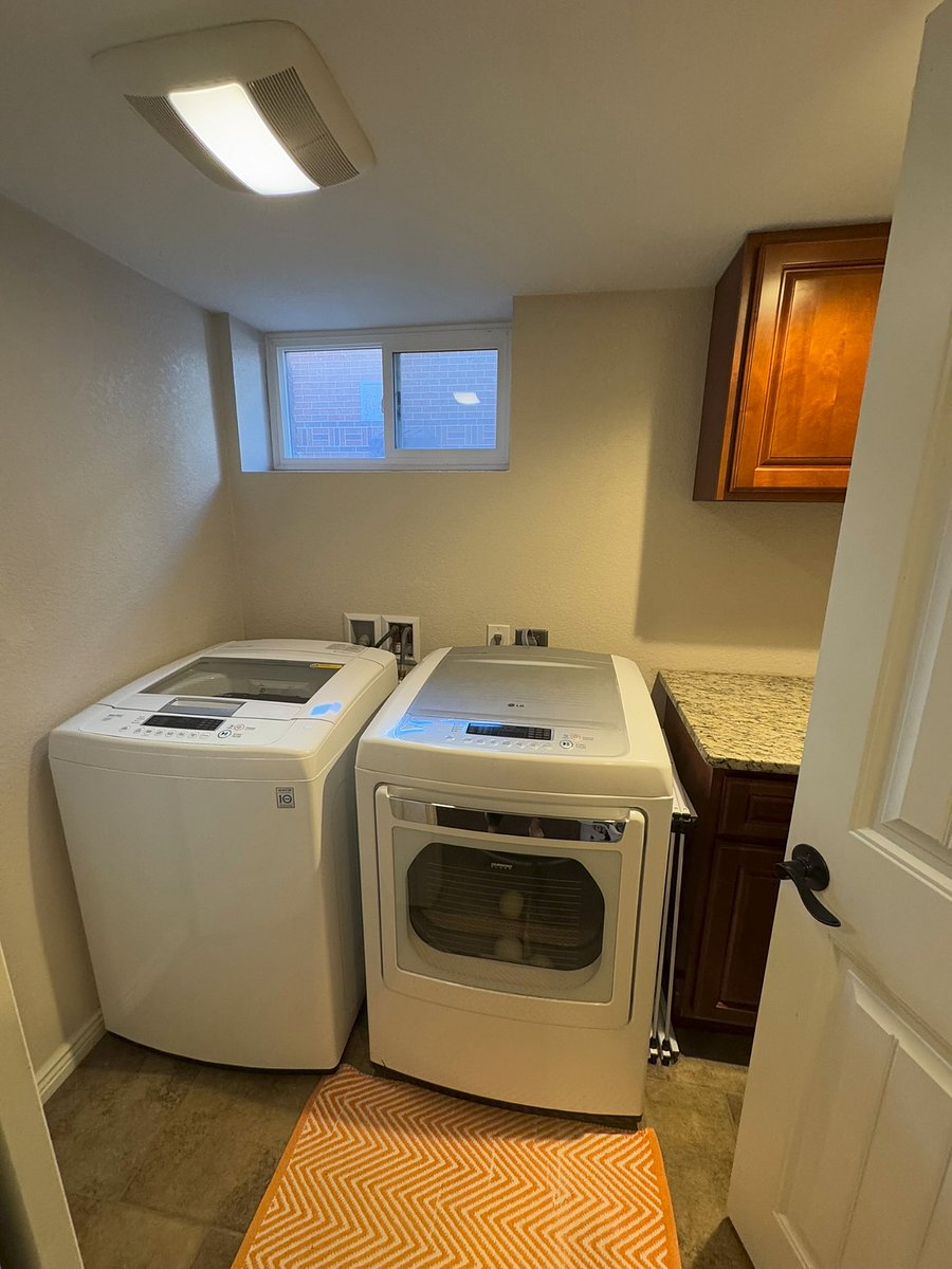 Full washer and dryer with ample counter and drying area
