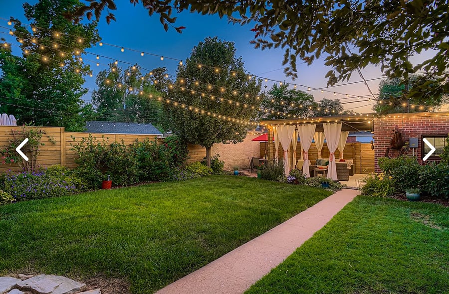 Lovely quaint fully landscaped yard with cabana, outdoor lighting and seating