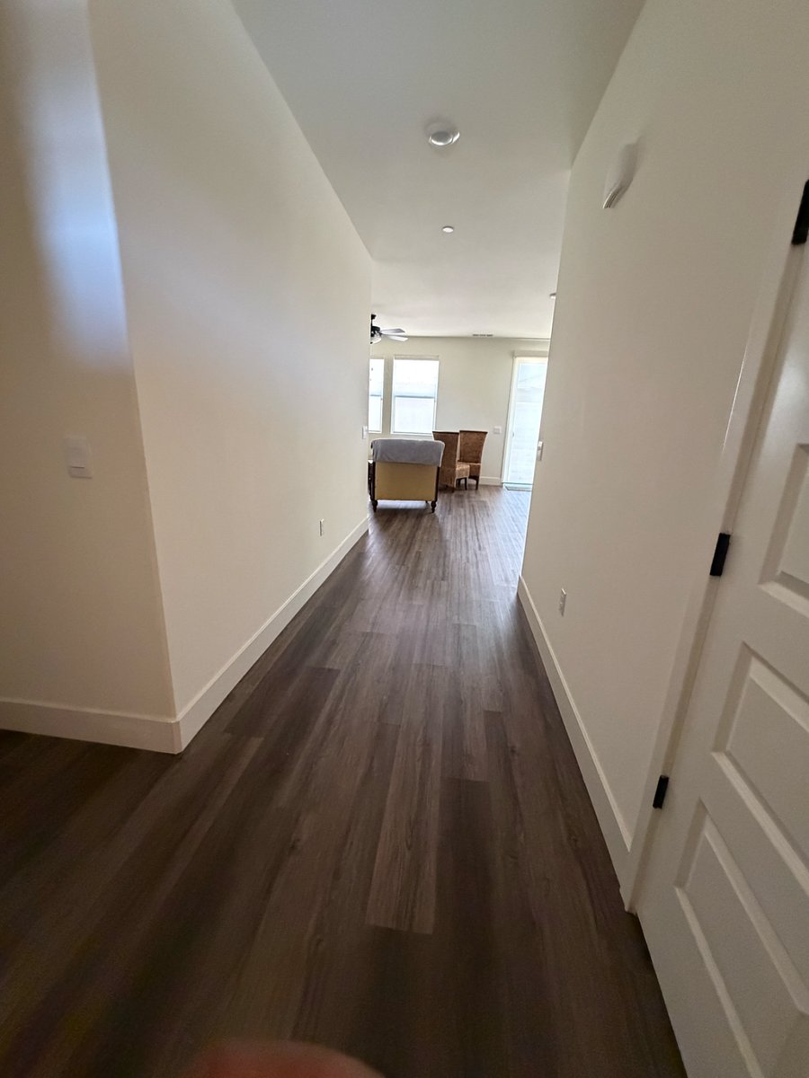 Hallway leading to living room and kitchen