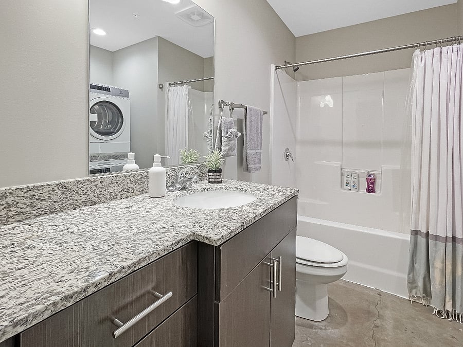 Bathroom with washer and dryer